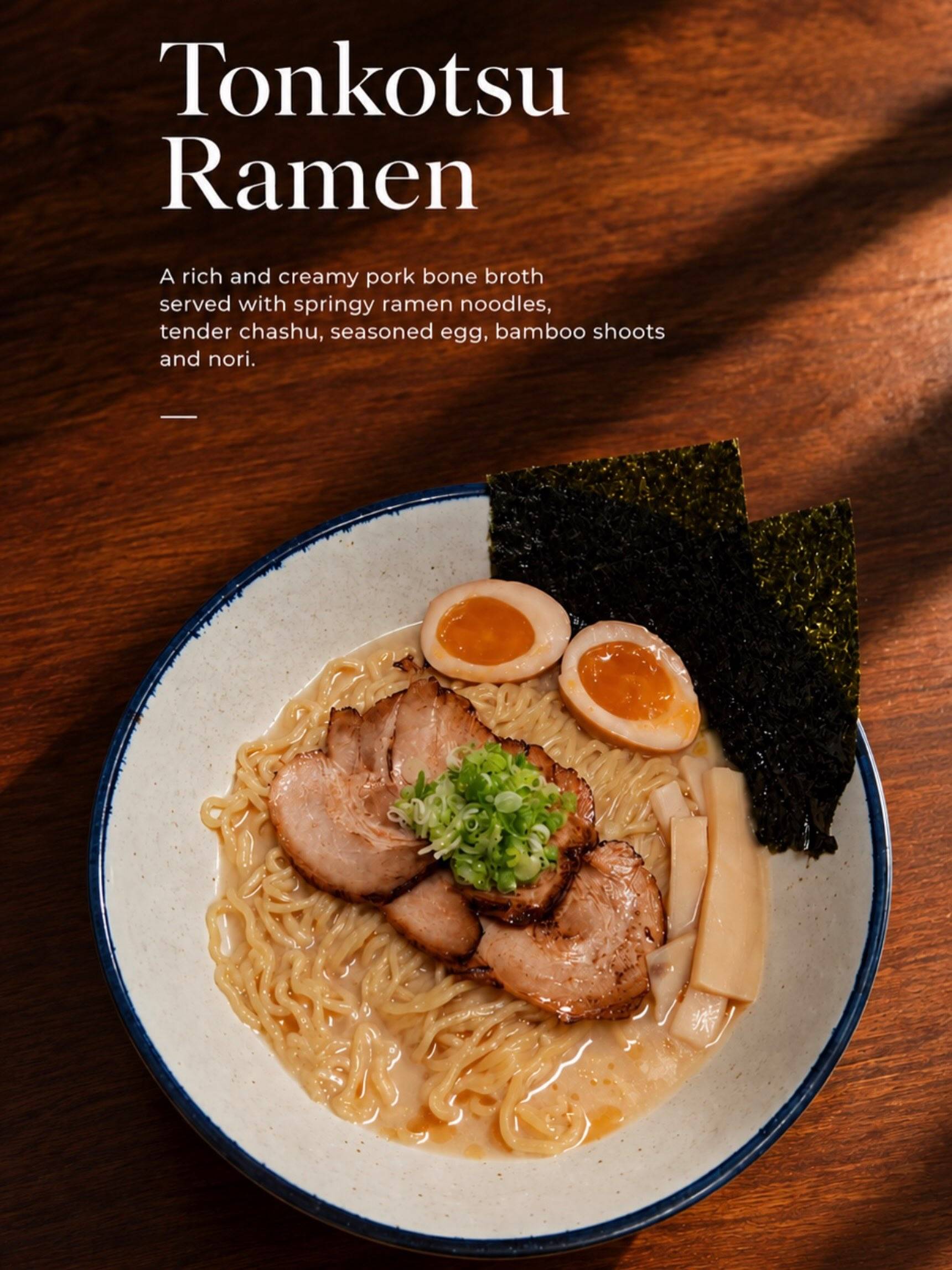 A bowl of ramen with chashu, a seasoned egg, nori and scallions in a pork-bone broth, with a description lettered on the image.